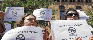 People protest against government healthcare cuts next to La Maternitat hospital in Barcelona