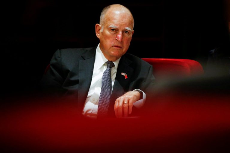 FILE PHOTO: California Governor Jerry Brown attends International Forum on Electric Vehicle Pilot Cities and Industrial Development in Beijing