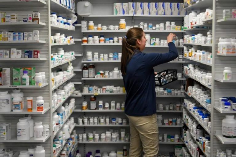 FILE PHOTO: A technician stocks the shelves of the pharmacy at White House Clinic in Berea