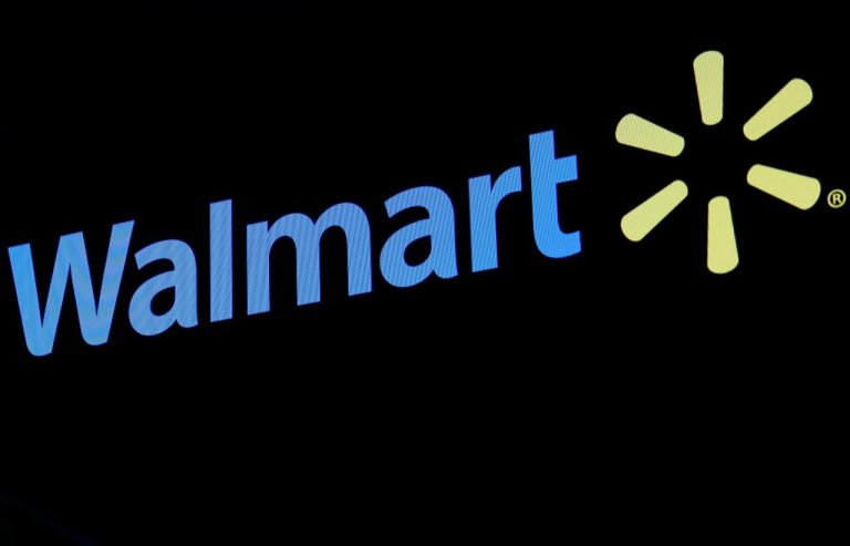 The Walmart logo is displayed on a screen on the floor of the NYSE in New York