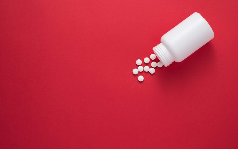 Pills spilling from a bottle