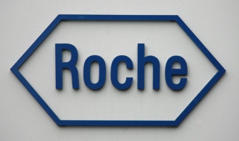 FILE PHOTO: The logo of Swiss pharmaceutical company Roche is pictured on the company's headquarters in Basel