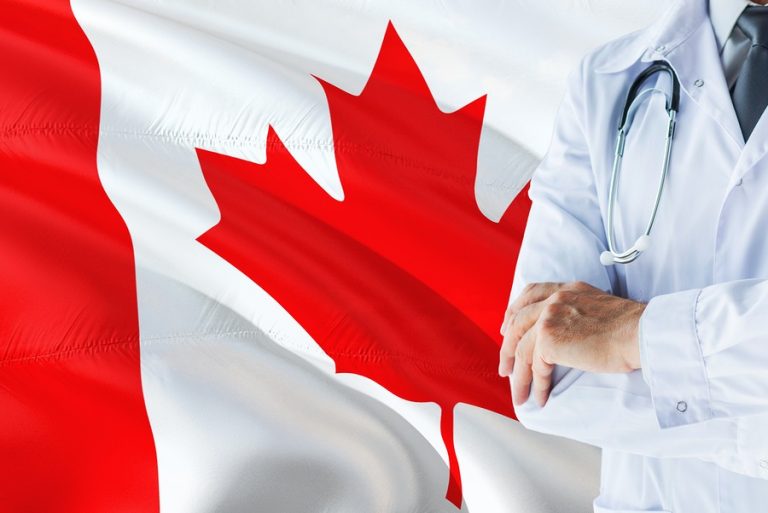 Canadian Doctor Standing With Stethoscope On Canada Flag Backgro
